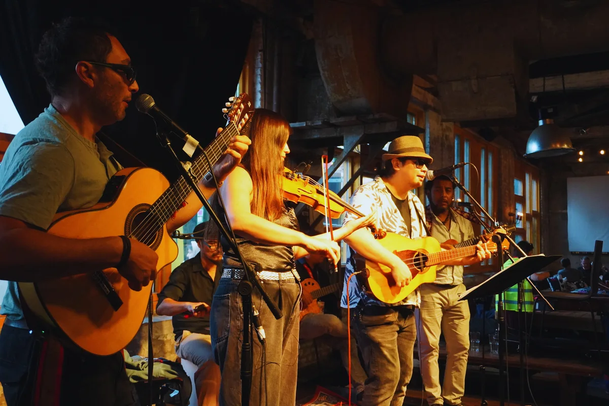 Migrant Sounds performing in an intimate venue