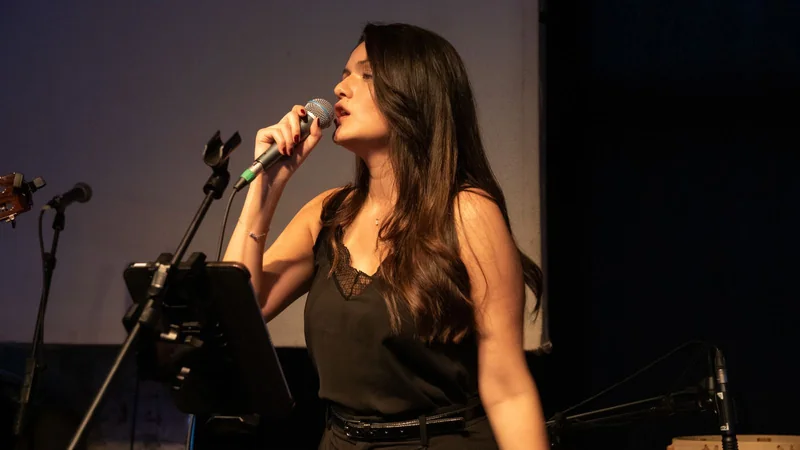 Isabella Bejarano Montes de Oca singing on stage